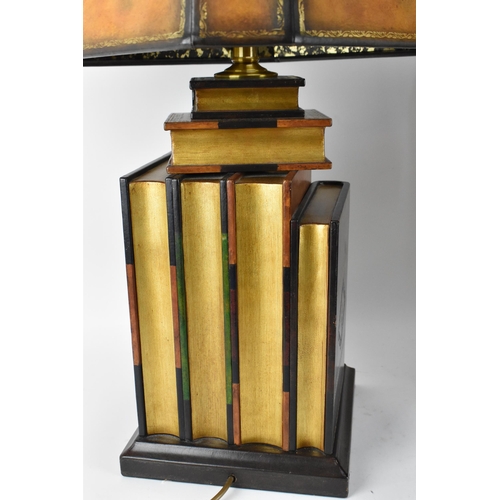 178 - A pair of Maitland-Smith faux book table lamps, with matching chamfered design shades with gilt tool... 