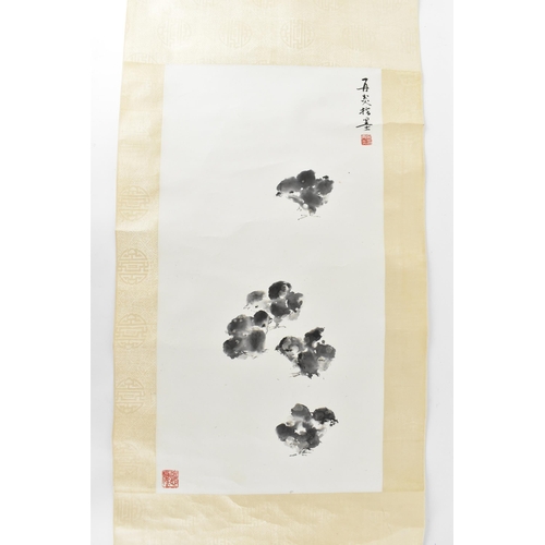 18 - A Chinese scroll black ink painting of chicks, with artist's red seal stamp signature bottom left an... 