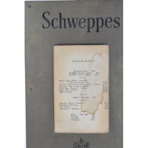 204 - An early 20th century brass Schweppes advertising menu frame, with glazed aperture containing an old... 