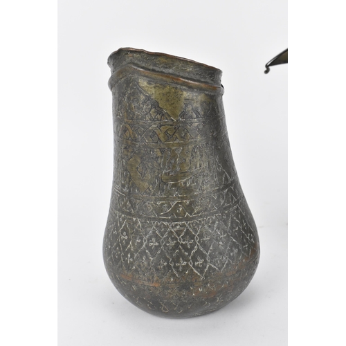 224 - A Middle Eastern Dallah coffee pot, with foliate pattern to the top half,27 cm high, together with a... 