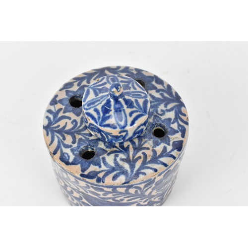 225 - An Ottoman ceramic ink well and pen holder, of cylindrical form with Iznik blue and white foliage de... 