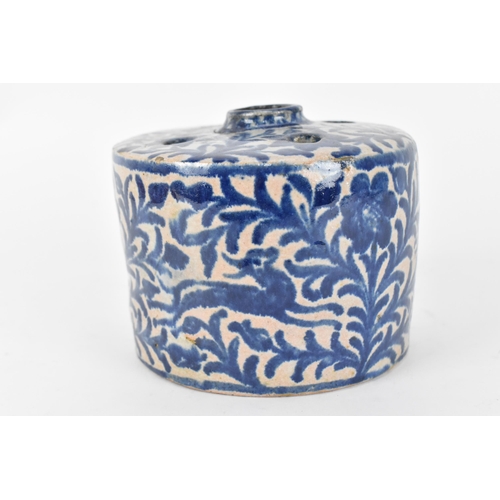 225 - An Ottoman ceramic ink well and pen holder, of cylindrical form with Iznik blue and white foliage de... 