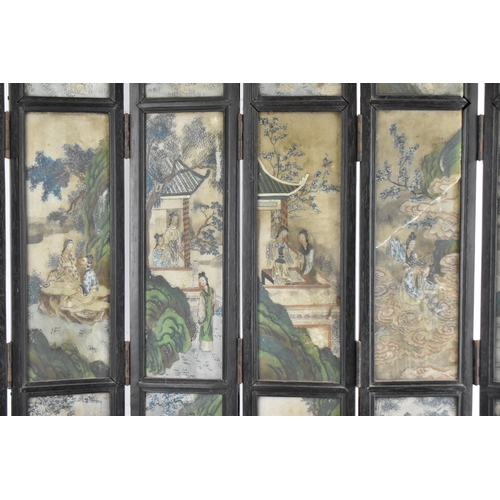 41A - A Chinese Qing Dynasty six-panel table screen, the stone panels with painted figures of women around... 