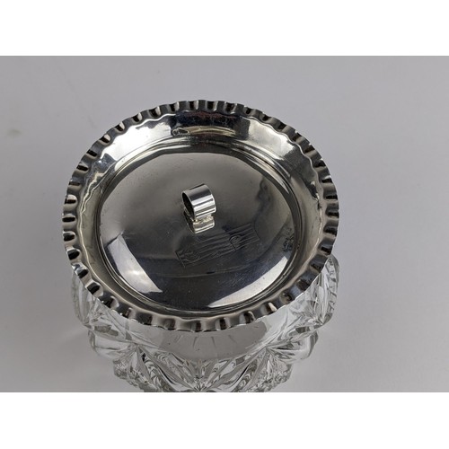 259 - An Edwardian cut glass and silver powder jar, the rim with a crimped edge and the lid engraved with ... 