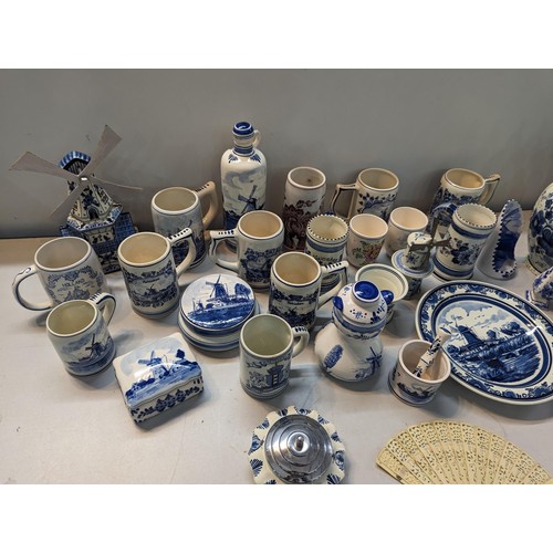 254 - Ceramics, mainly blue and white Delft pottery to include tankards, plates, candlesticks, lidded vase... 