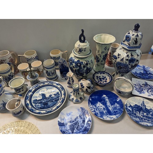 254 - Ceramics, mainly blue and white Delft pottery to include tankards, plates, candlesticks, lidded vase... 