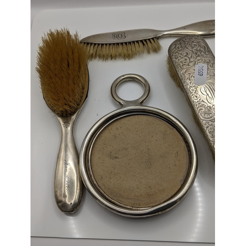 110 - Early 20th century silver dressing table items to include a sterling silver mirror A/F, with matchin... 