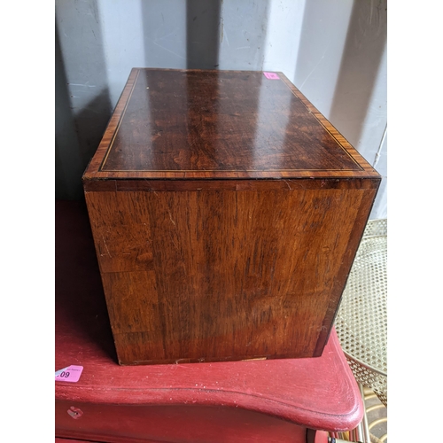 114 - A 19th century collectors chest of three graduating drawers having boxwood inlaid and turned handles... 