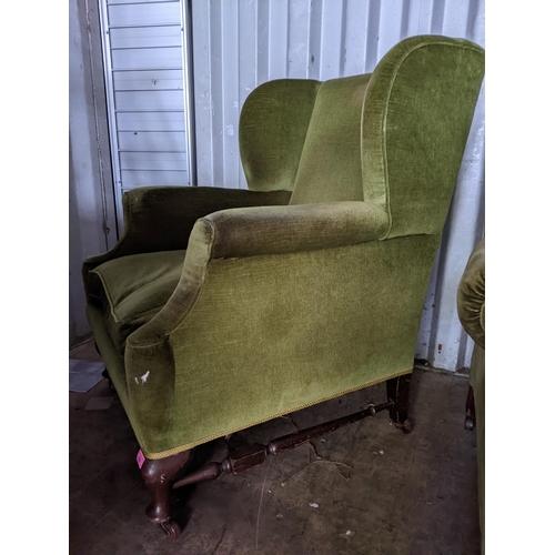 120 - An early/mid 0th century wingback green upholstered armchair on short mahogany cabriole legs
Locatio... 