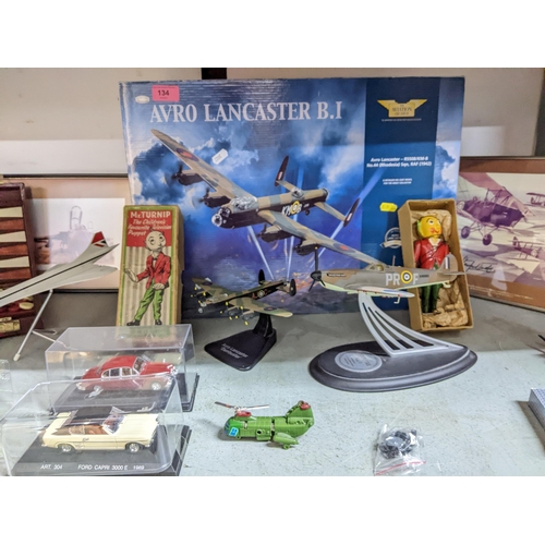 134 - A selection of vintage diecast model cars, model aeroplanes to include Concorde and Avro Lancaster, ... 