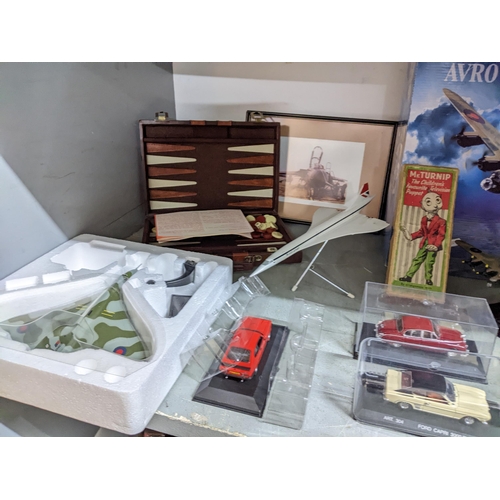 134 - A selection of vintage diecast model cars, model aeroplanes to include Concorde and Avro Lancaster, ... 