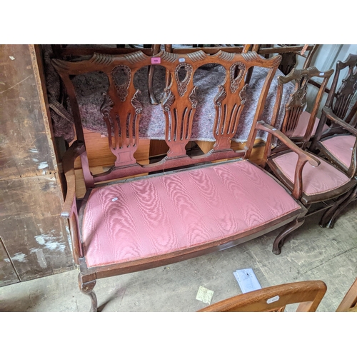 169 - An early 20th century mahogany Chippendale style two seater chair together with six matching chairs
... 