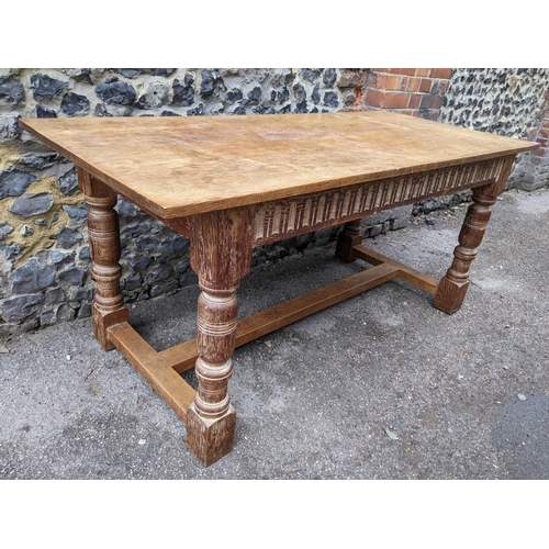 184 - withdrawn A 17th century style oak refectory ding table having limed oak carved apron and legs, poss... 