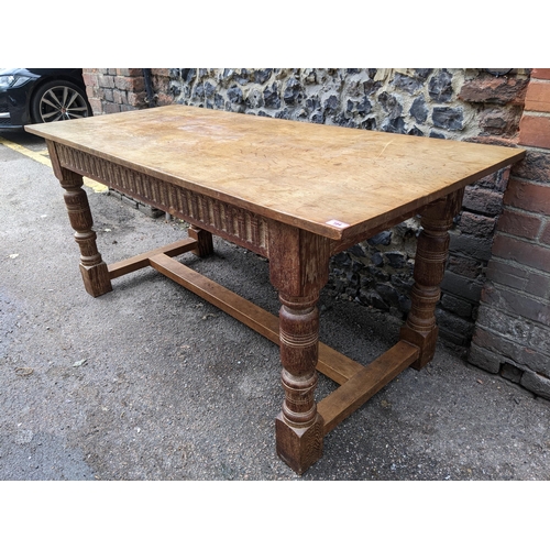 184 - withdrawn A 17th century style oak refectory ding table having limed oak carved apron and legs, poss... 