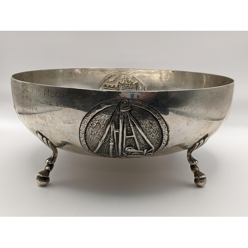 216 - A Cypriot white metal bowl embossed with medallions and on ball feet, stamped 800, 473.8g
Location:7... 