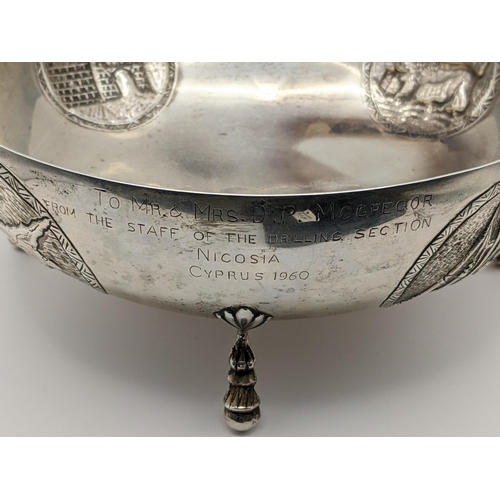 216 - A Cypriot white metal bowl embossed with medallions and on ball feet, stamped 800, 473.8g
Location:7... 