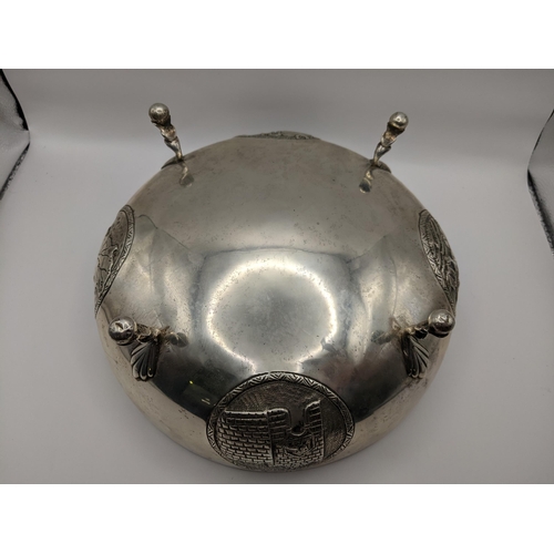 216 - A Cypriot white metal bowl embossed with medallions and on ball feet, stamped 800, 473.8g
Location:7... 