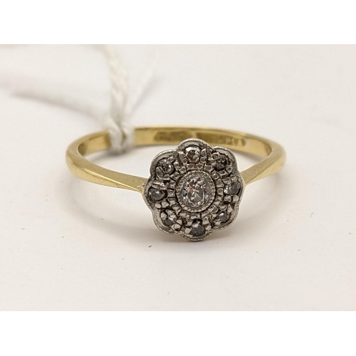 221 - An 18ct gold and platinum diamond daisy ring, 2.1g
Location:RING