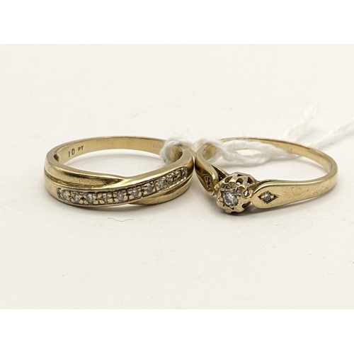 222 - Two 9ct gold diamond inset rings to include one having a central diamond with diamond set shoulders,... 