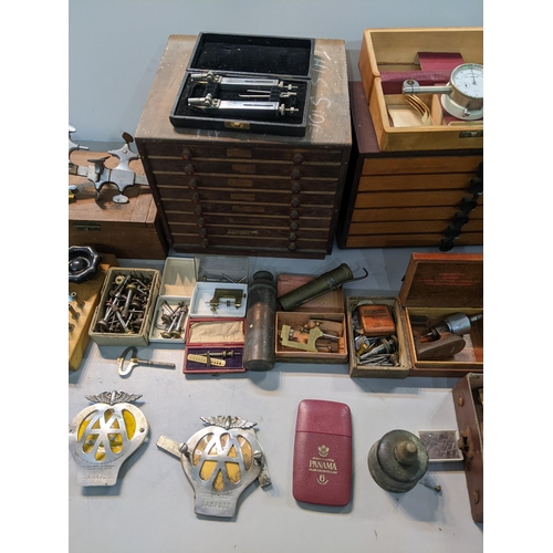 267 - A mixed lot of mainly watch makers tools together with vintage AA badges, oil cans, vintage tools ch... 