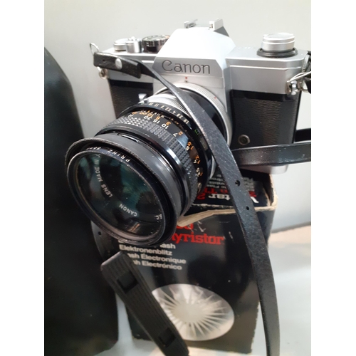 297 - A Canon TLB camera with accessories and lenses to include Tamron. Location:9.6