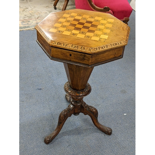 306 - A Victorian walnut trumpet formed sewing table having a marquetry chequerboard top and on cabriole l... 