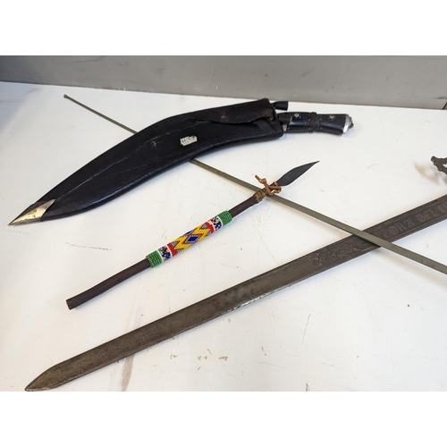 335 - Edged weapons and similar items to include a Kukri, reproduction Lizona Del Cid, a foil and two Afri... 