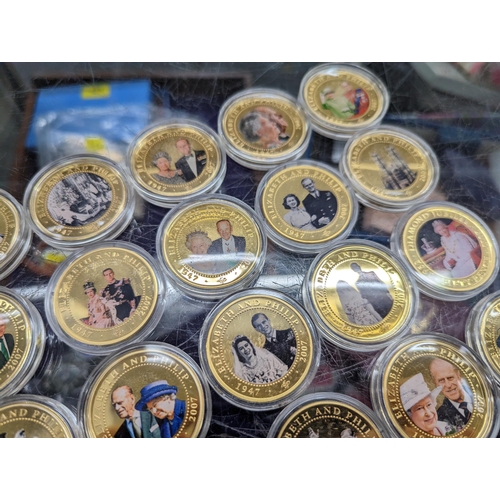 358 - Coins-A collection of 23 gold plated Royal Mint 2007 Diamond Wedding, Her Majesty The Queen and His ... 