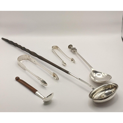 48 - Silver to include 2 sugar tongs, a seal spoon 130g, a toddy ladle and a Scandinavian spoon. Location... 