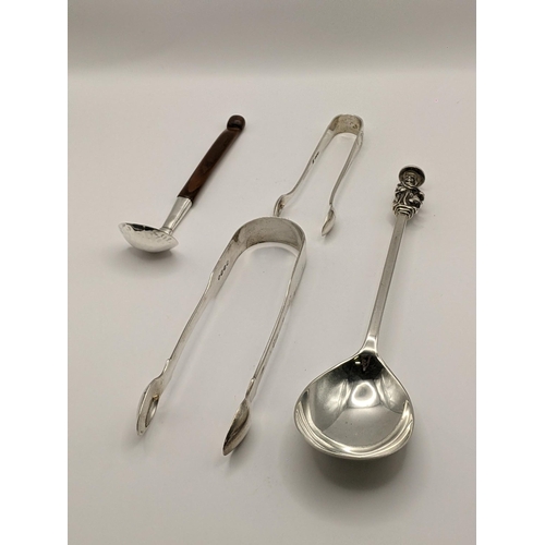 48 - Silver to include 2 sugar tongs, a seal spoon 130g, a toddy ladle and a Scandinavian spoon. Location... 