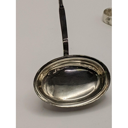 48 - Silver to include 2 sugar tongs, a seal spoon 130g, a toddy ladle and a Scandinavian spoon. Location... 