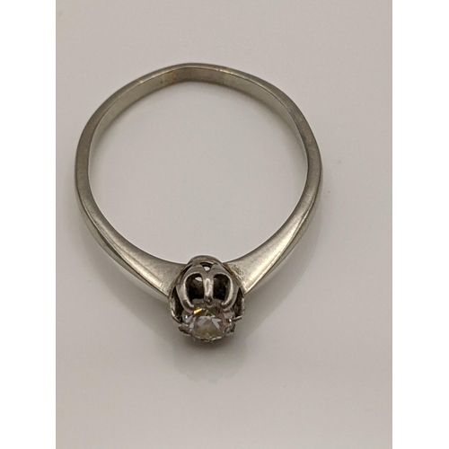 55 - A white metal ring set with a diamond A/F, total weight 2g Location:CAB3