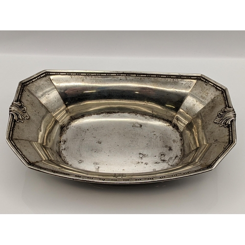 72 - An early/mid 20th century sterling silver octagonal formed dish having sausage and pea decoration an... 