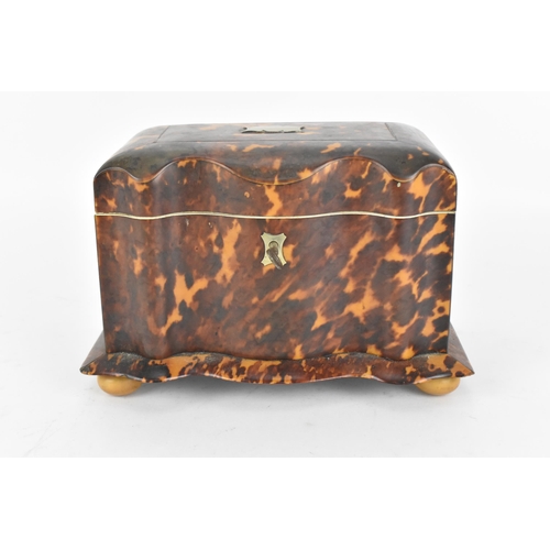 200 - A 19th century tortoiseshell and ivory tea caddy, Regency period, with twin division interior with l... 