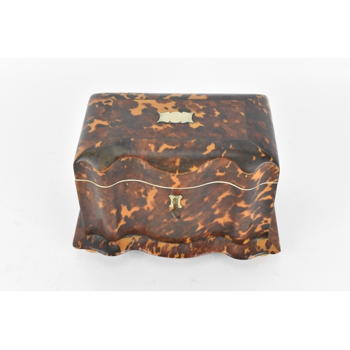 200 - A 19th century tortoiseshell and ivory tea caddy, Regency period, with twin division interior with l... 