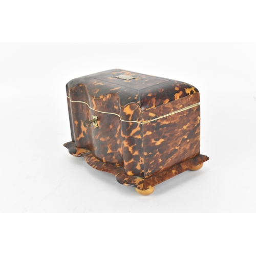 200 - A 19th century tortoiseshell and ivory tea caddy, Regency period, with twin division interior with l... 