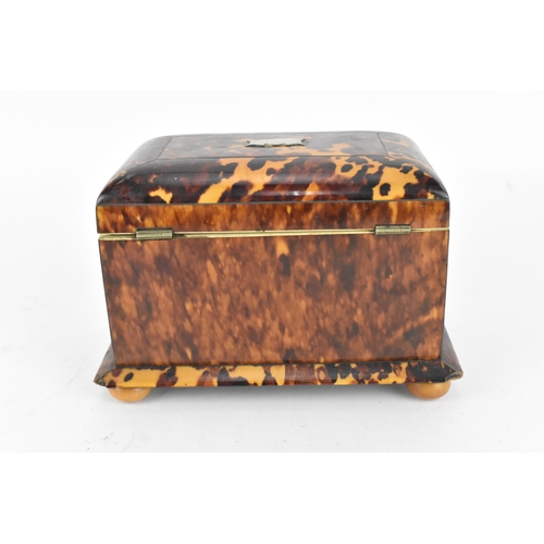 200 - A 19th century tortoiseshell and ivory tea caddy, Regency period, with twin division interior with l... 