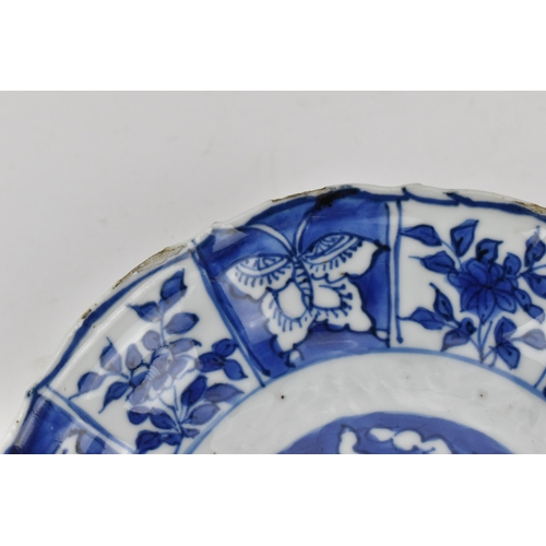 232 - A small Chinese blue and white kraak dish, late Ming/transitional period, with barbed rim, the cavet... 