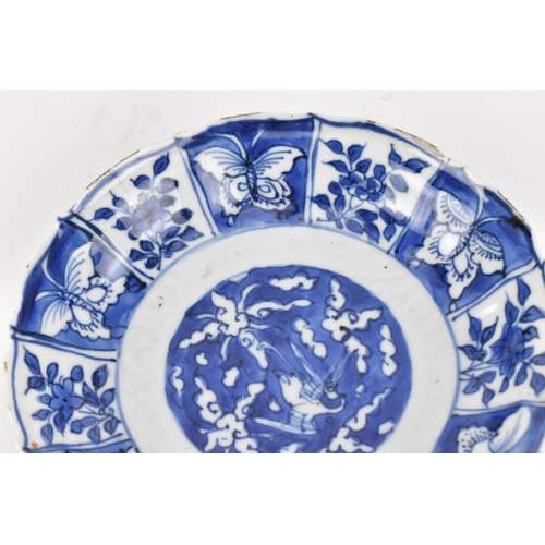 232 - A small Chinese blue and white kraak dish, late Ming/transitional period, with barbed rim, the cavet... 