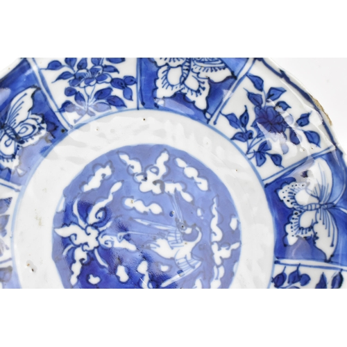 232 - A small Chinese blue and white kraak dish, late Ming/transitional period, with barbed rim, the cavet... 