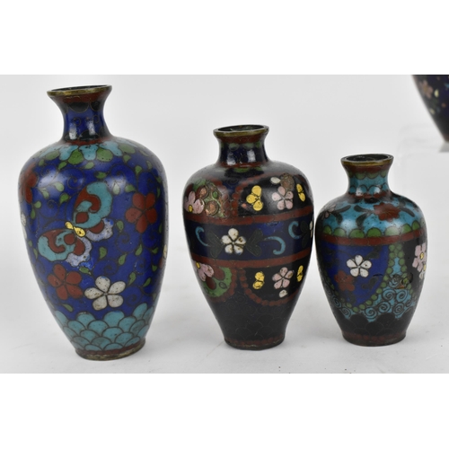 234 - A small collection of Japanese cloisonne enamel vases, Meiji period, comprising a larger vase decora... 