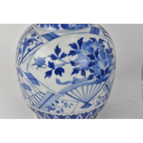 236 - A pair of Japanese export blue and white porcelain vases by Zoshuntei Sanpo Zu, shop owned by Hisato... 