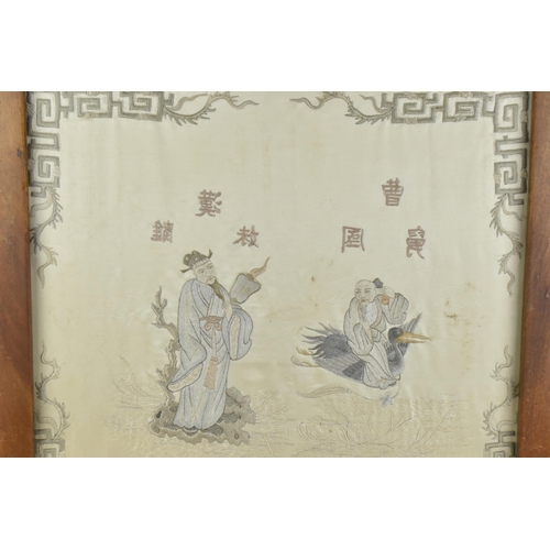 48 - A Chinese embroidered silk picture, framed within a hardwood fire screen, the embroidered image depi... 