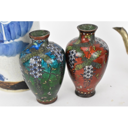 90 - A small collection of Oriental works, comprising a Chinese crackle glazed blue and white cylindrical... 