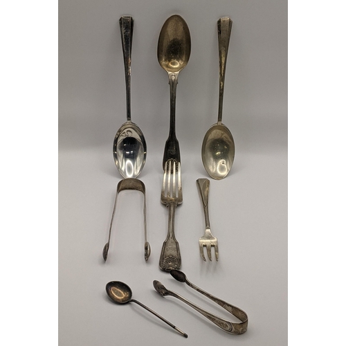 11 - Silver flatware to include silver sugar tongs, hallmarked London 1802, a fiddle pattern shaped spoon... 