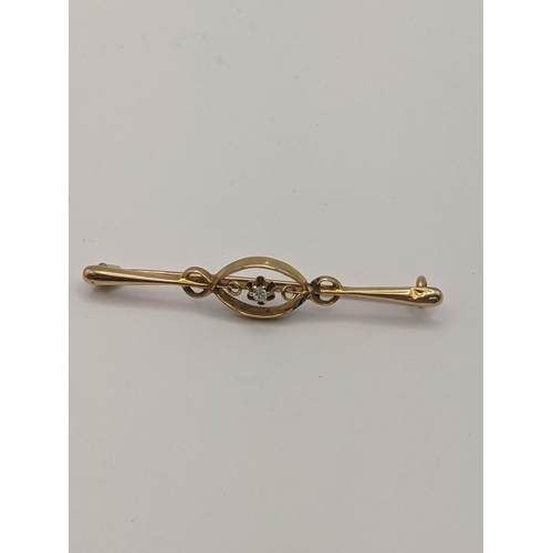 15 - An 18ct gold brooch 1.7g, together with a yellow metal brooch set with a diamond, total weight 3.5g ... 