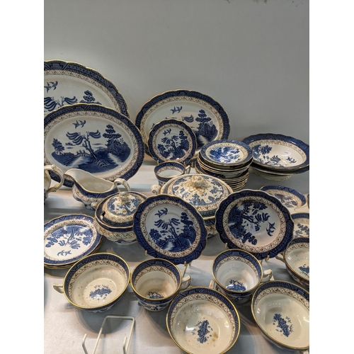 167 - A Booths dinner a tea service in the blue and white, Real Old Willow Pattern to include tureen, sauc... 