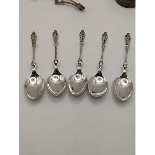 17 - A silver napkin ring, together with five silver teaspoons hallmarked London 1913, and one other, tot... 