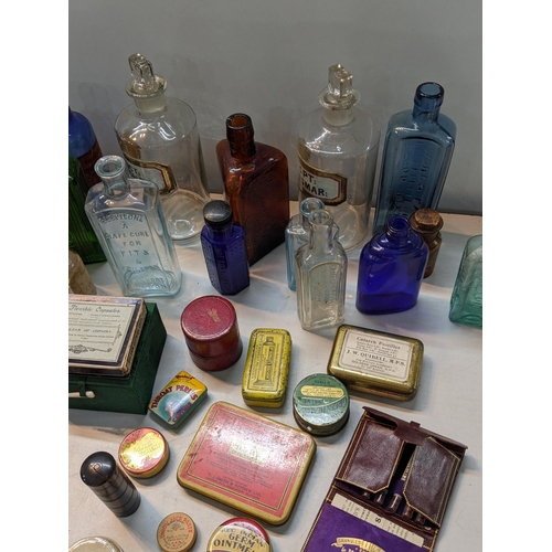 171 - A collection of pharmaceutical to include Victorian and later glass medicine bottles to include pota... 