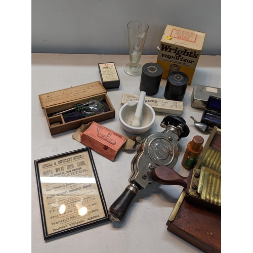 172 - A Victorian apothecary pill making machine, together with Dr Macauras blood circulator and other med... 